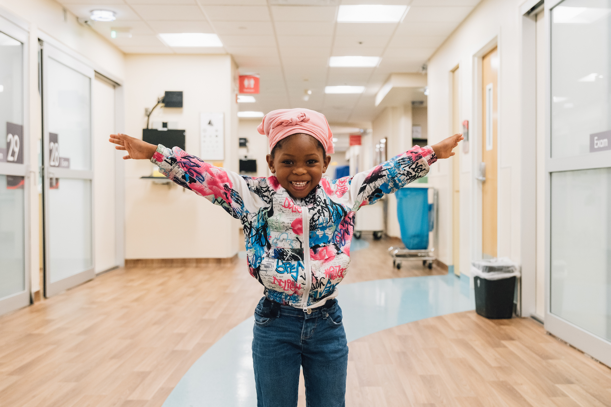 A young girl excited after being treated at the pediatric emergency department
