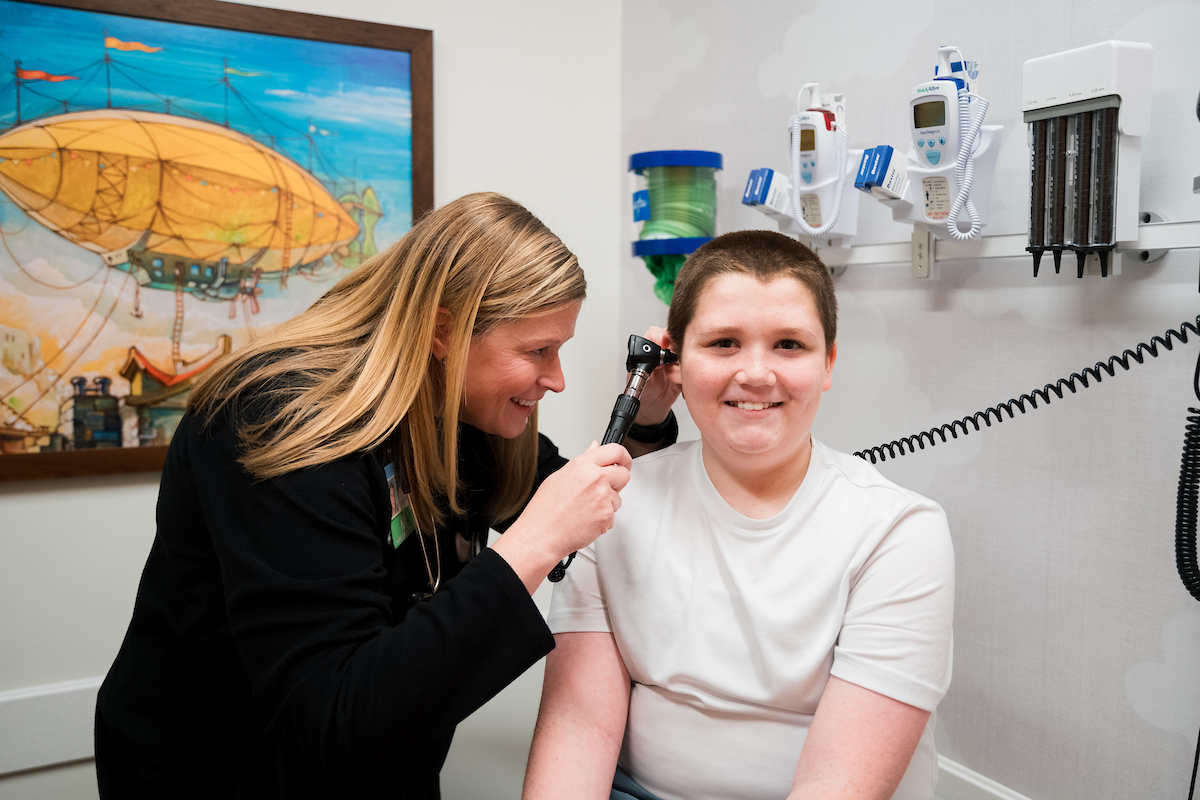 nurse practitioner giving exam to patientu201d