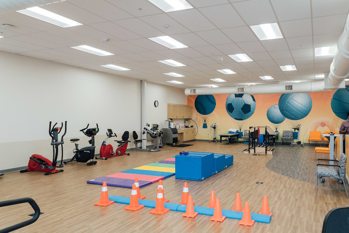 Large gym area with specialty equipment made just for kids for rehabilitation services.