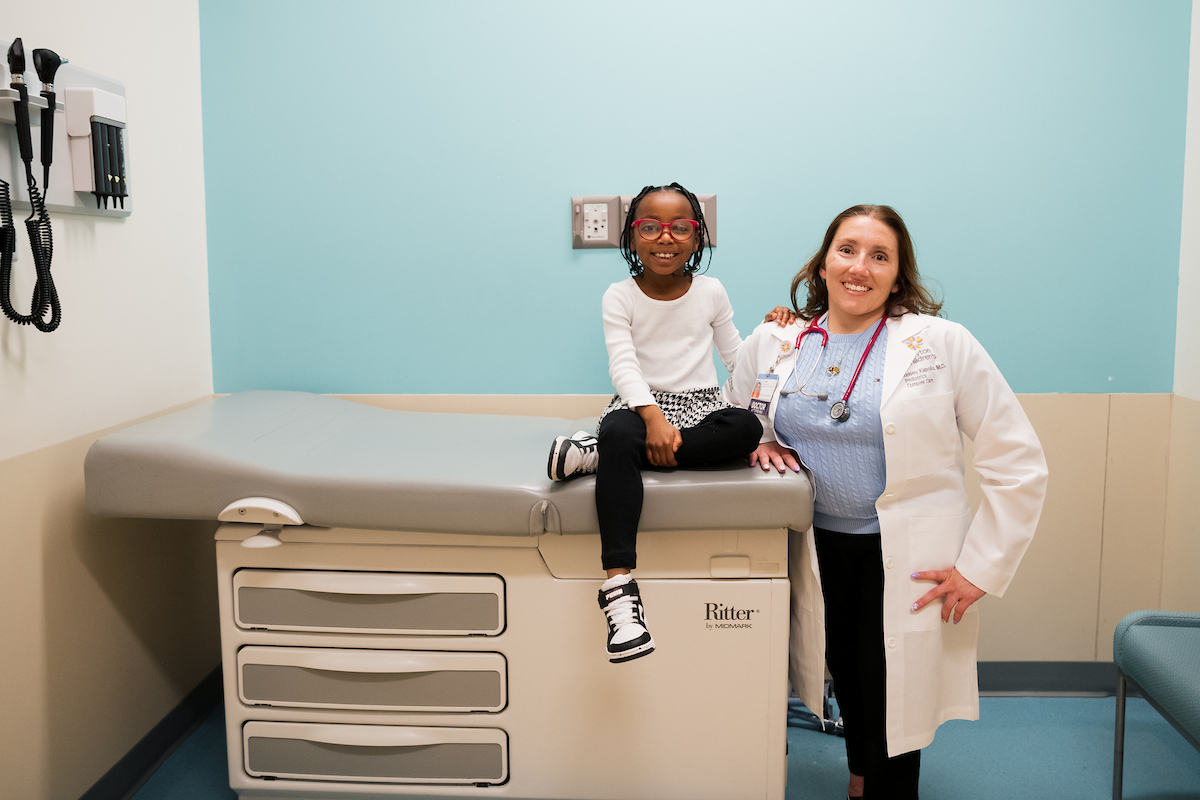 primary care pediatrician caring for child during well-child visit