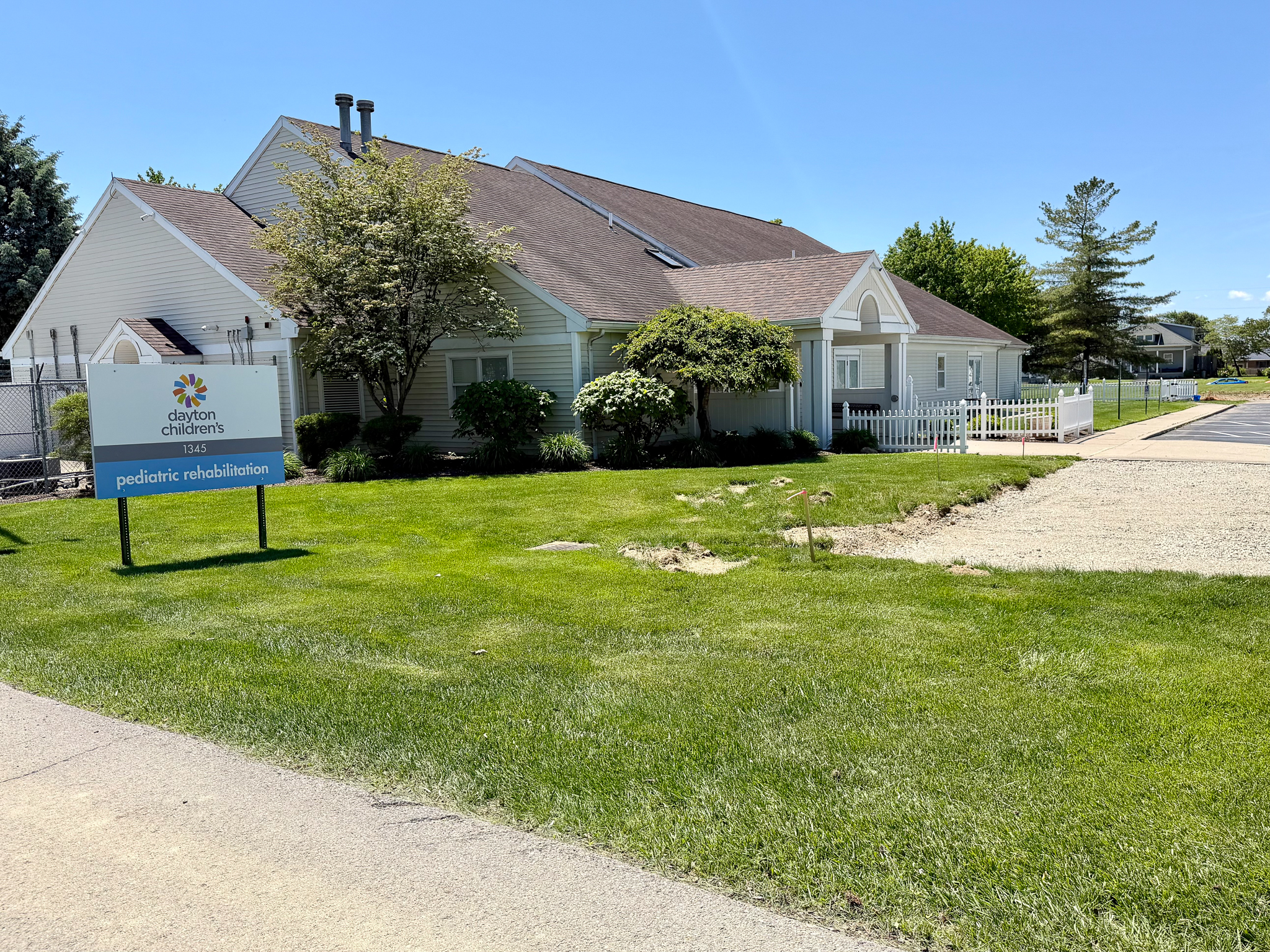 exterior view of single story building for pediatric rehabilitation with large sign